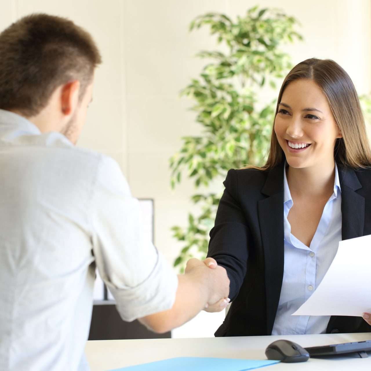 Successful job interview with boss and employee handshaking